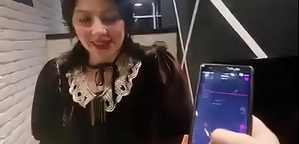  cute girl with remote vibrator in public